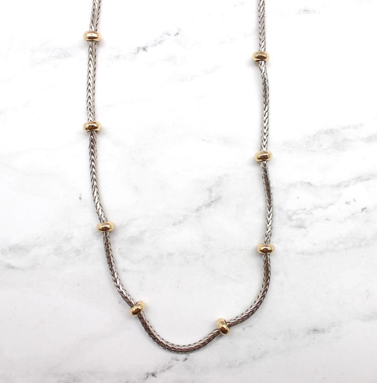 A photo of the Gold Beads Silver Chain product