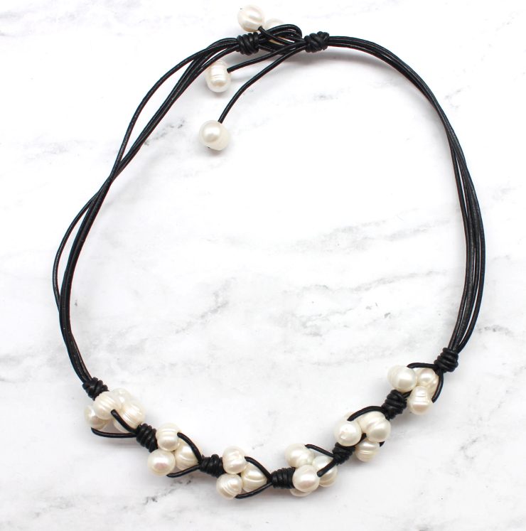 A photo of the Pearls On A Cord Necklace product