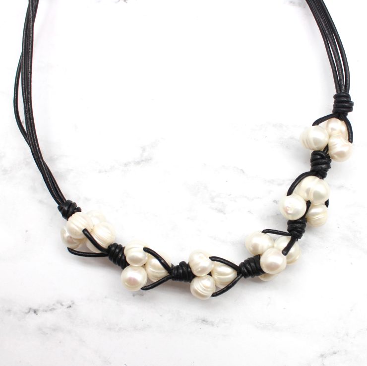 A photo of the Pearls On A Cord Necklace product