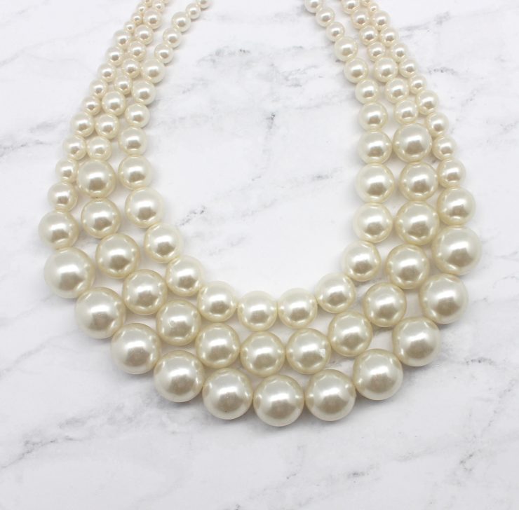 A photo of the Perfect Preppy Pearls Necklace product