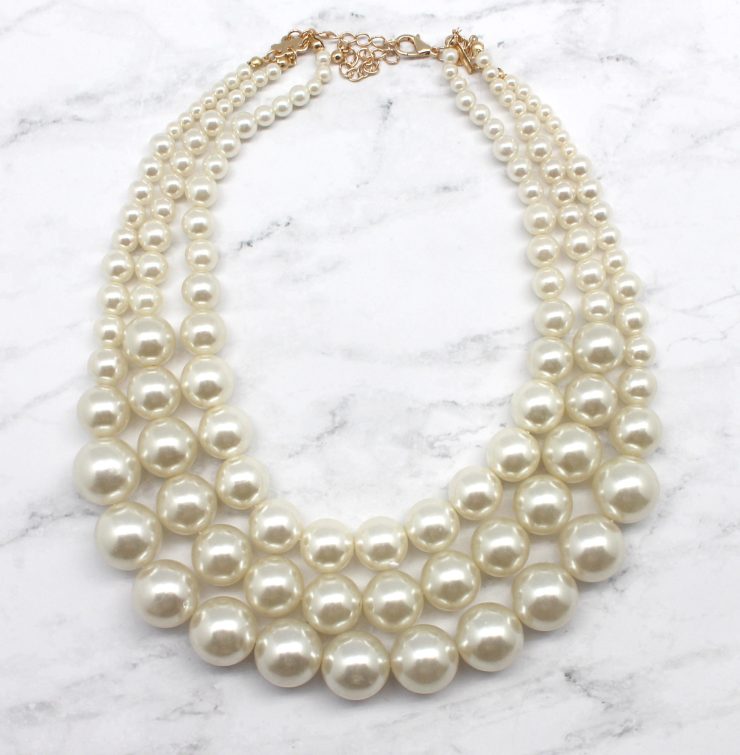 A photo of the Perfect Preppy Pearls Necklace product