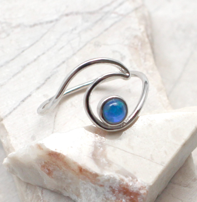 Wave ring deals with blue stone