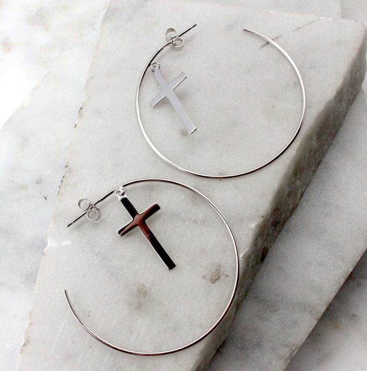 A photo of the Cross Hoop Earrings product