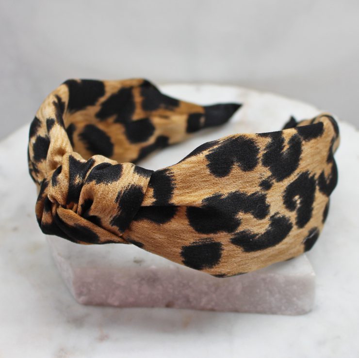 A photo of the Leopard Headband In Brown product