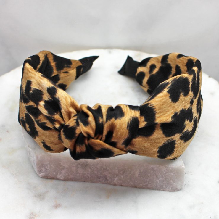 A photo of the Leopard Headband In Brown product