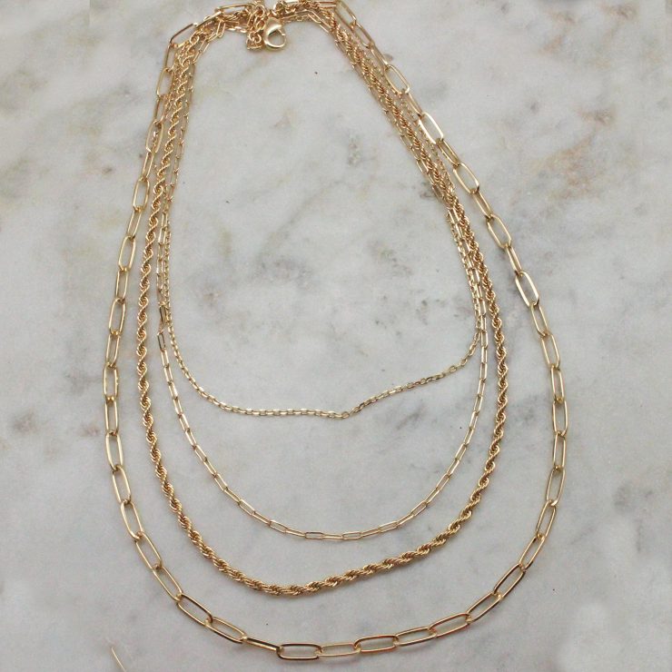 A photo of the Layered Paper Clip Necklace In Gold product