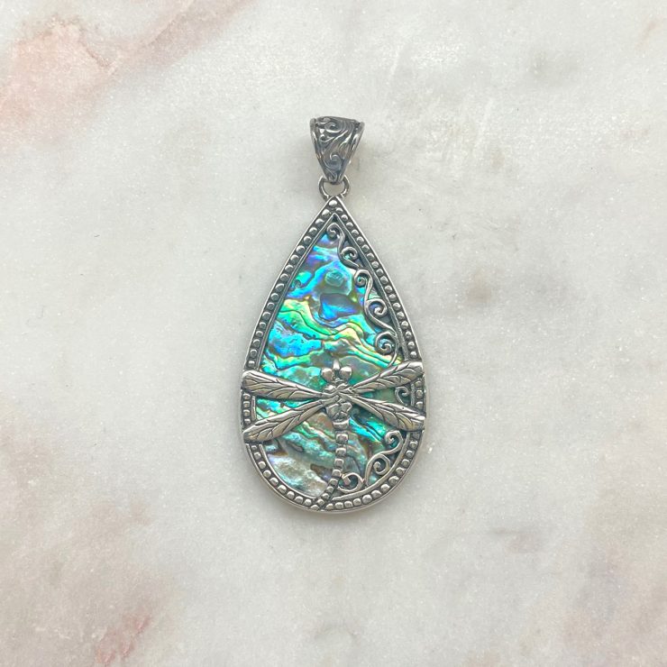 A photo of the Abalone & Sterling Silver Dragonfly Pendant product