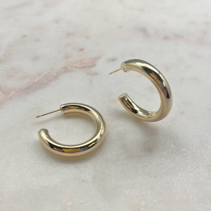 A photo of the Classic Gold Hoops product