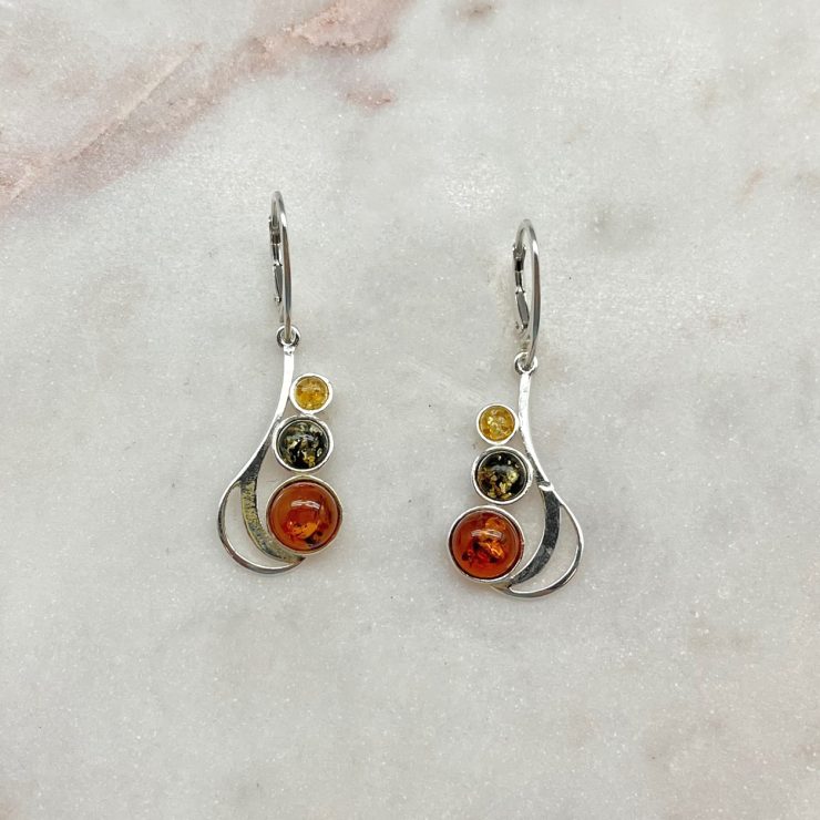 A photo of the Tri Colored Amber Drop Earrings product