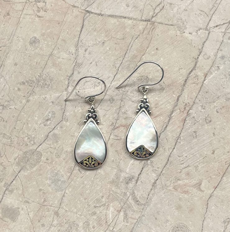 A photo of the Teardrop Mother of Pearl Earrings product