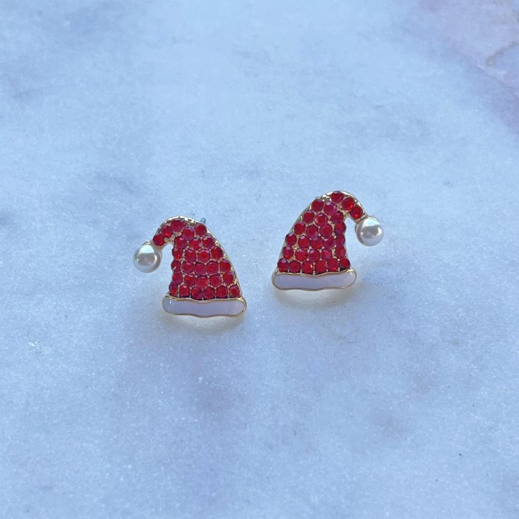 A photo of the Santa Hat Stud Earrings product