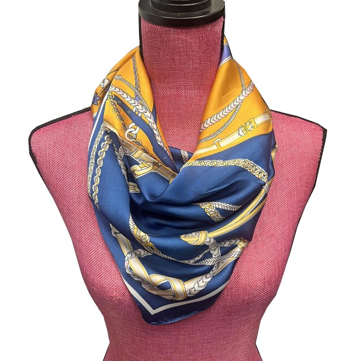 A photo of the Rope & Chain Scarf in Navy & Orange product