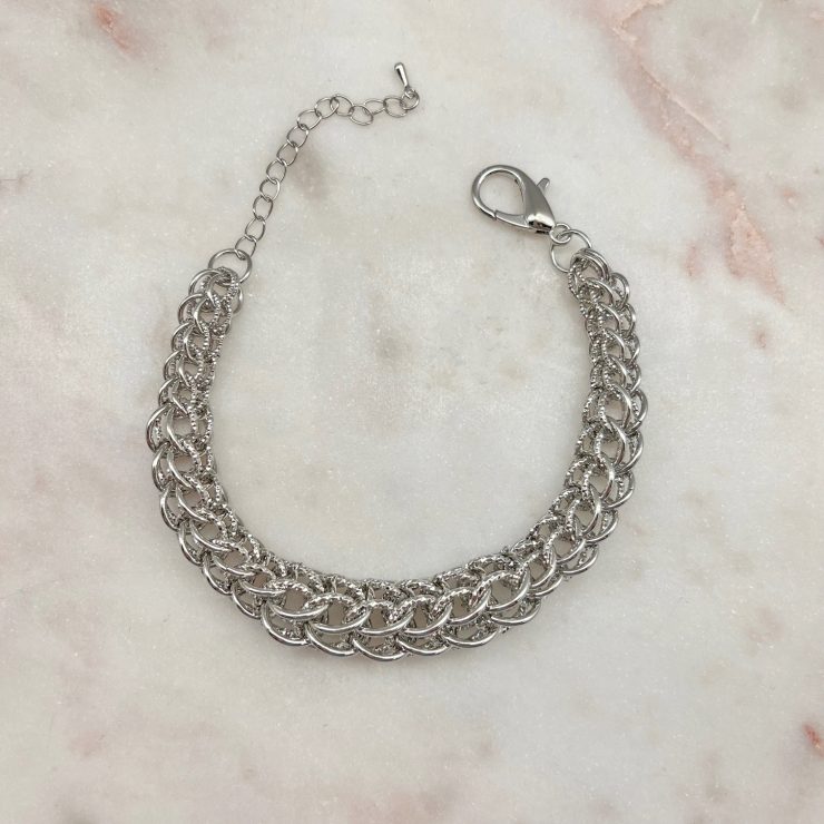 A photo of the Woven Cage Bracelet in Silver product