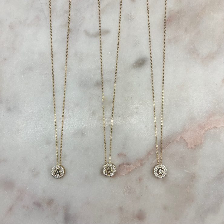 A photo of the Small Initial Necklace In Gold product