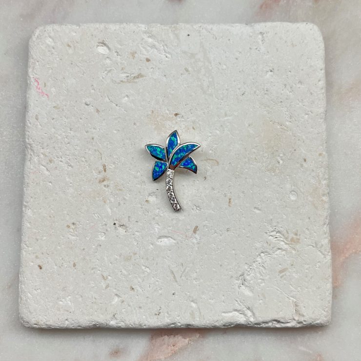 A photo of the Blue Opal Palm Tree Pendant product