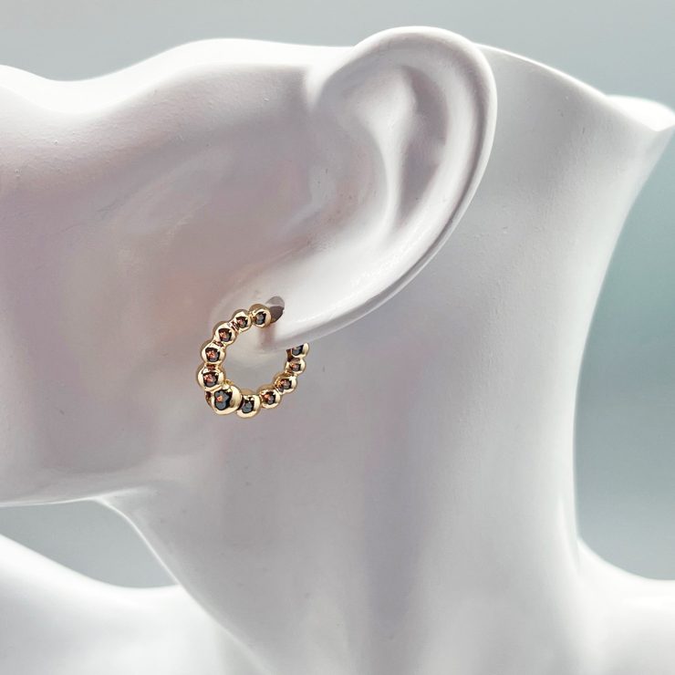 A photo of the Bubble Hoop Earrings in Gold product