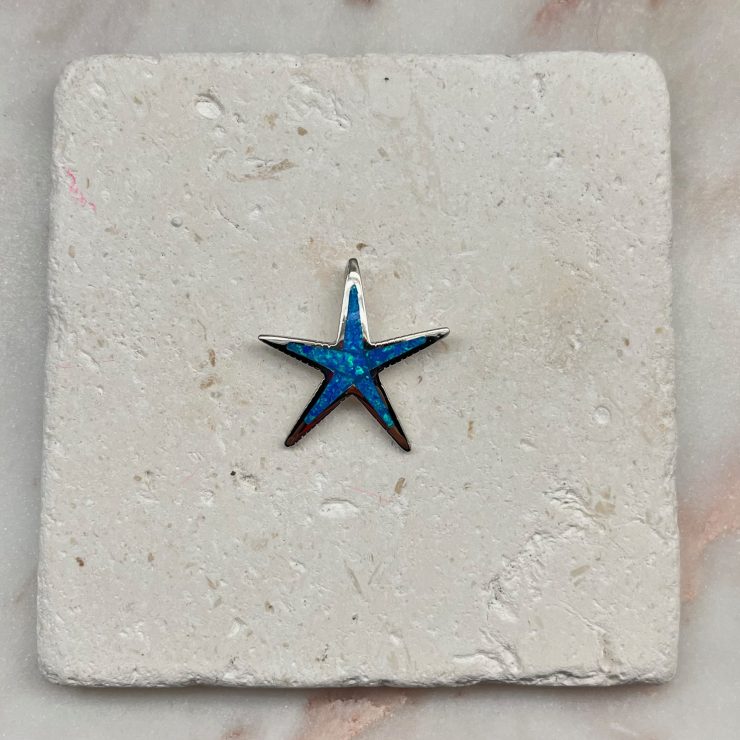 A photo of the Blue Opal Starfish Pendant product