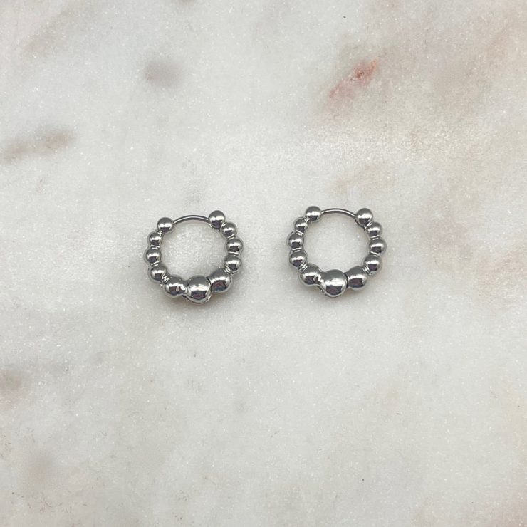 A photo of the Bubble Hoop Earrings in Silver product