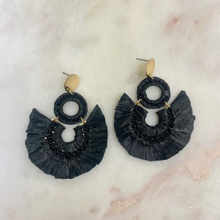 A photo of the Lolita Raffia Earrings in Black product