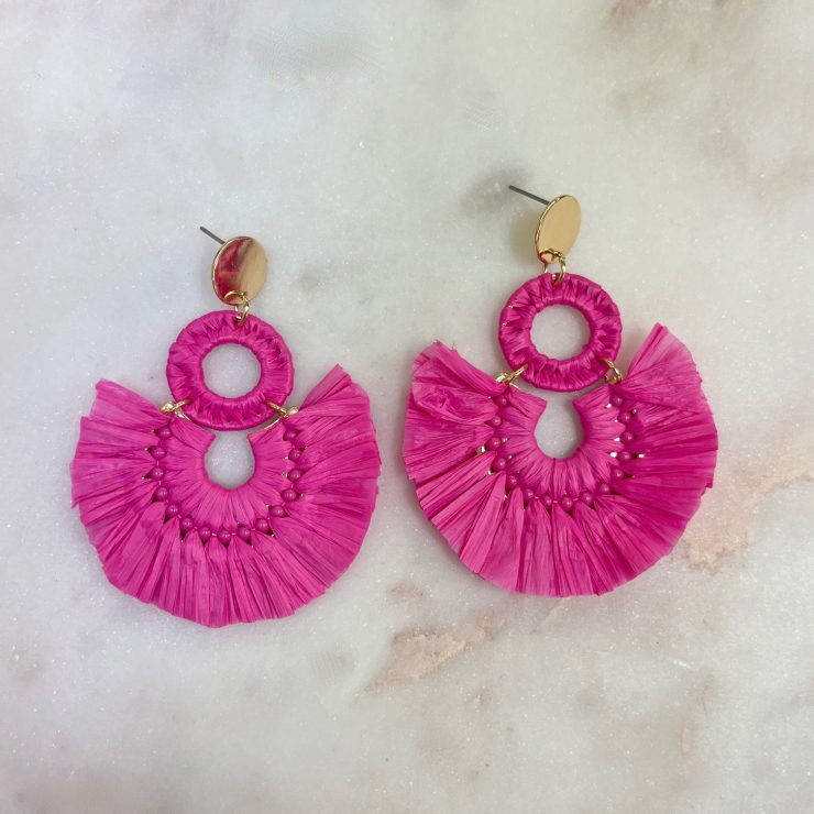 A photo of the Lolita Raffia Earrings in Hot Pink product