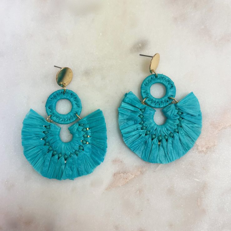 A photo of the Lolita Raffia Earrings in Turquoise product