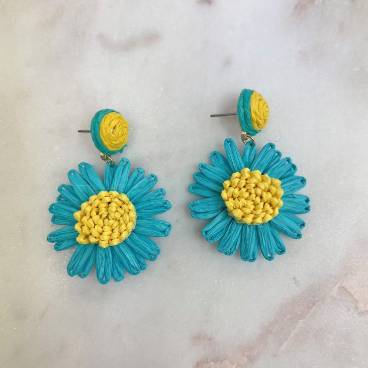 A photo of the Small Daisy Raffia Earrings in Turquoise product