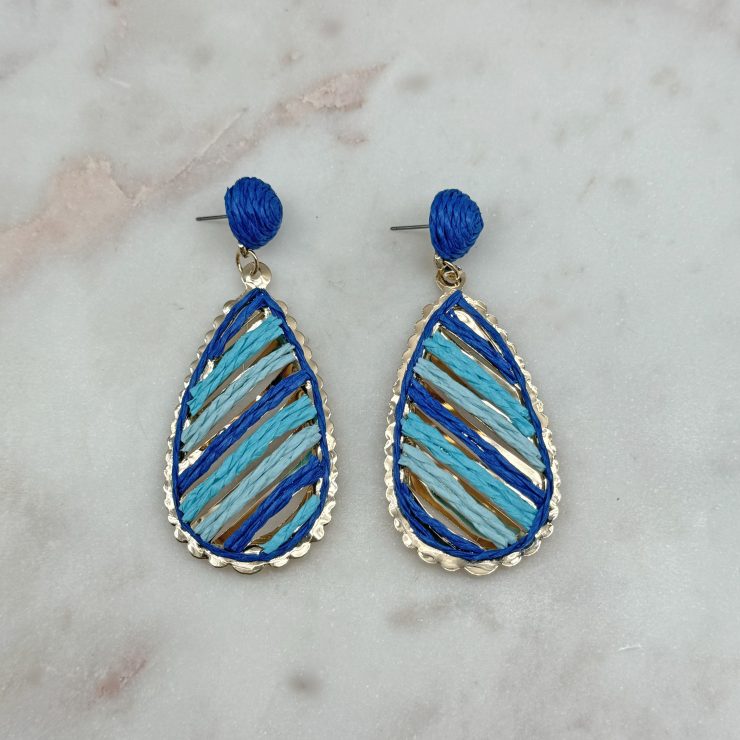 A photo of the Serena Raffia Earrings in Blue product