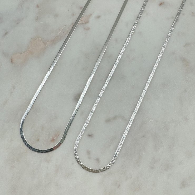 A photo of the Sterling Silver Herringbone Chain with Cutout Design product