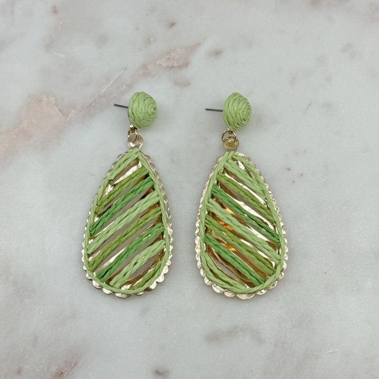 A photo of the Serena Raffia Earrings in Green product