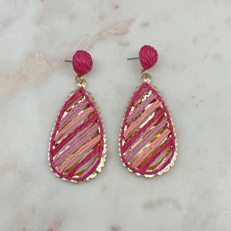 A photo of the Serena Raffia Earrings in Pink product