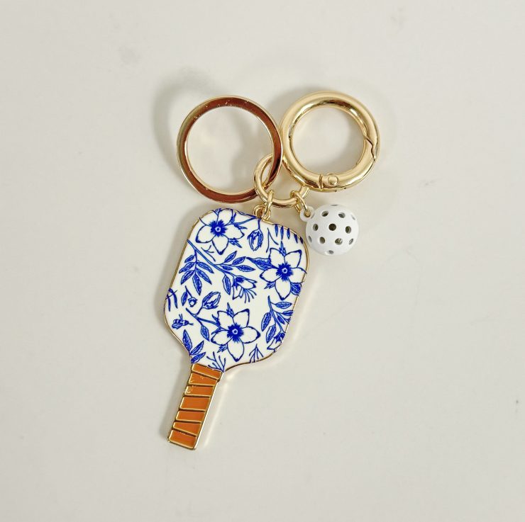 A photo of the Blue & White Pickleball Keychain product