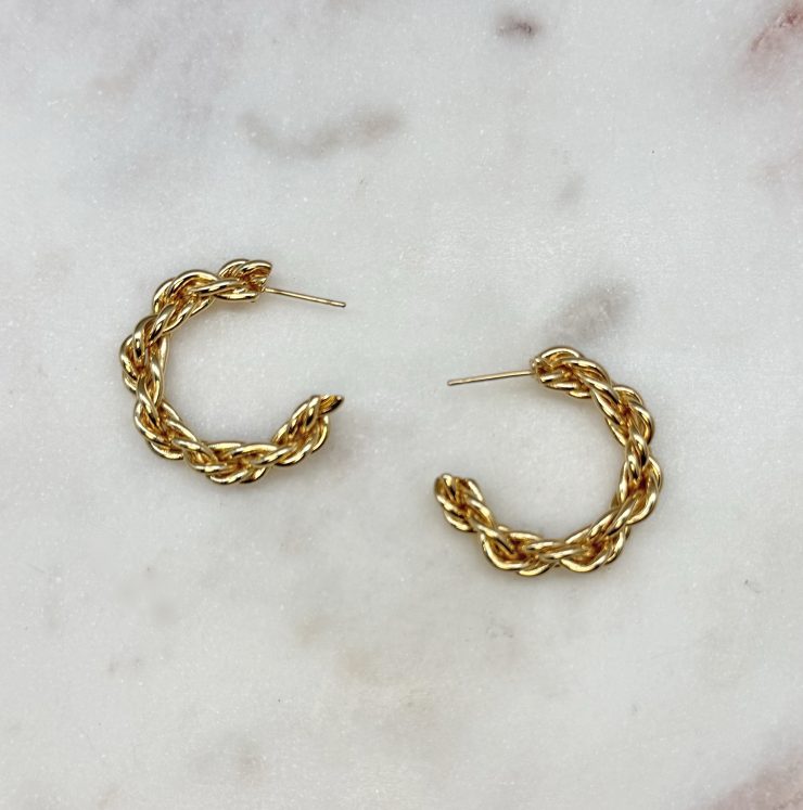 A photo of the Braided Gold Hoops product