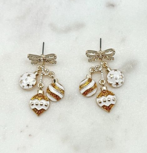 A photo of the Gold & White Ornament Earrings product