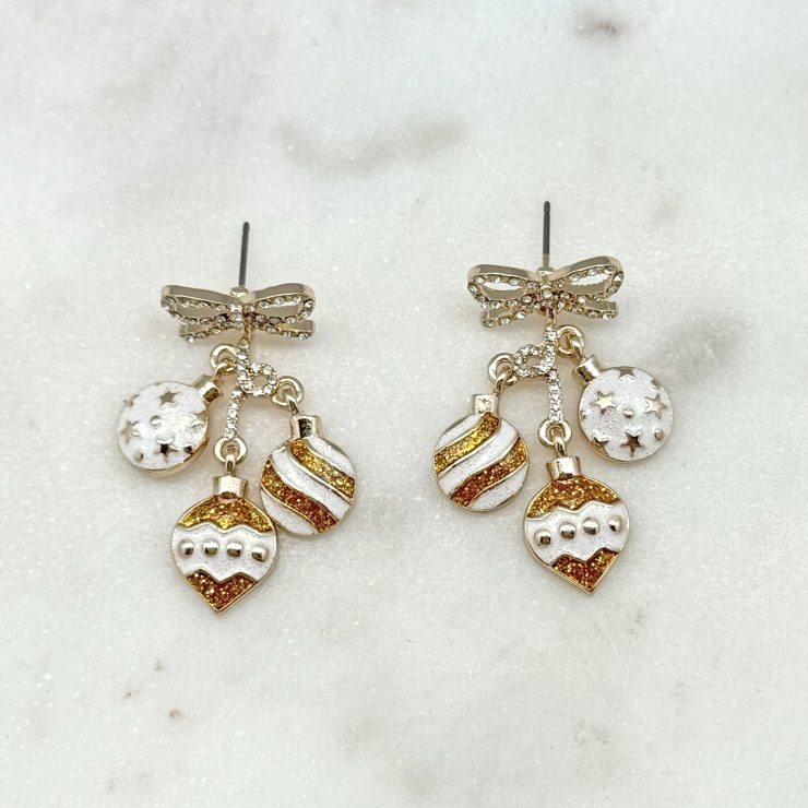 A photo of the Gold & White Ornament Earrings product