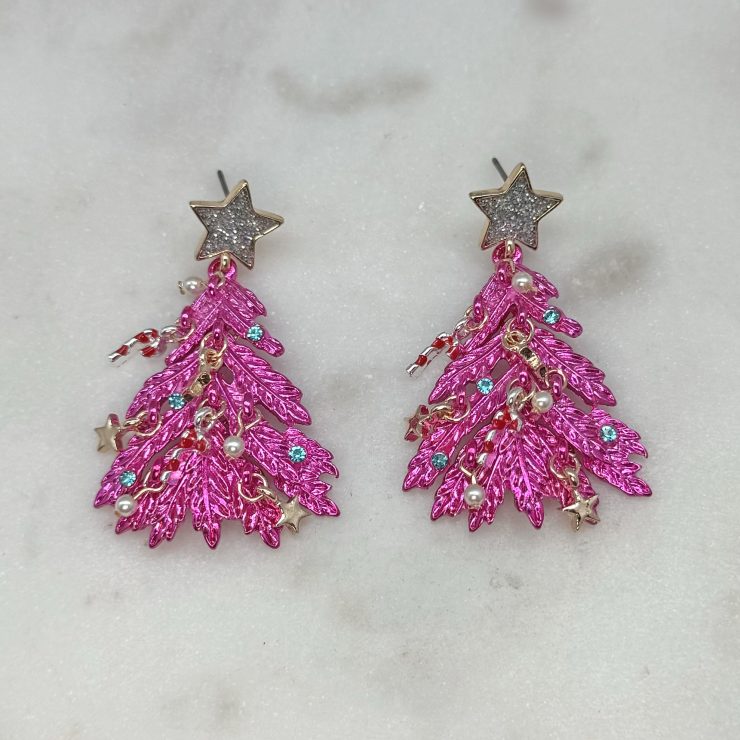 A photo of the Pink Shaggy Christmas Tree Earrings product