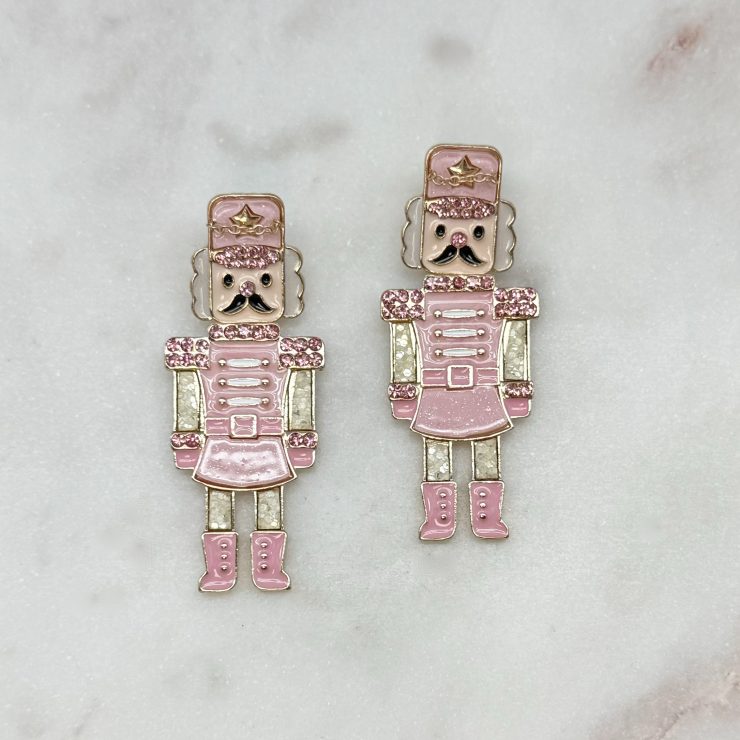 A photo of the Rosie Pink Nutcracker Earrings product