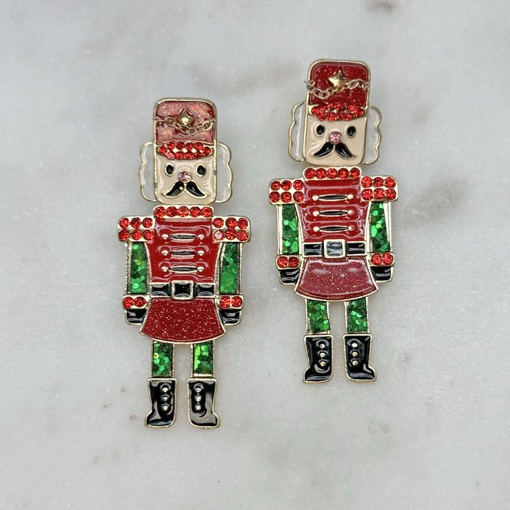 A photo of the The Glitzy Nutcracker Earrings product