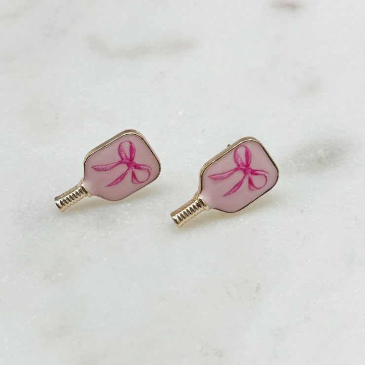 A photo of the Pink Bow Pickleball Studs in Light Pink product