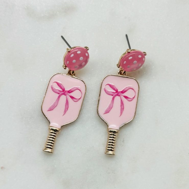 A photo of the Pink Bow Pickleball Earrings in Light Pink product