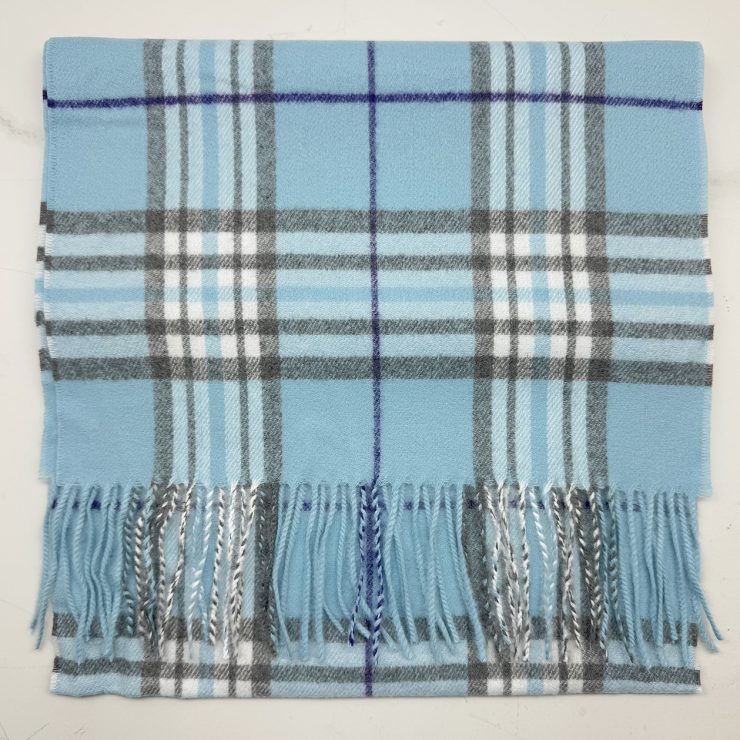 A photo of the Baby Blue Tartan Cashmere Feel Scarf product