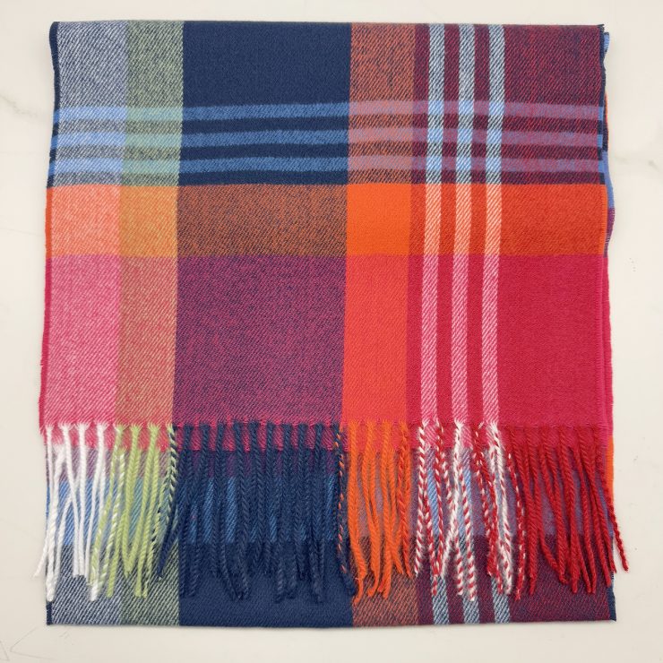 A photo of the Pink & Navy Plaid Cashmere Feel Scarf product