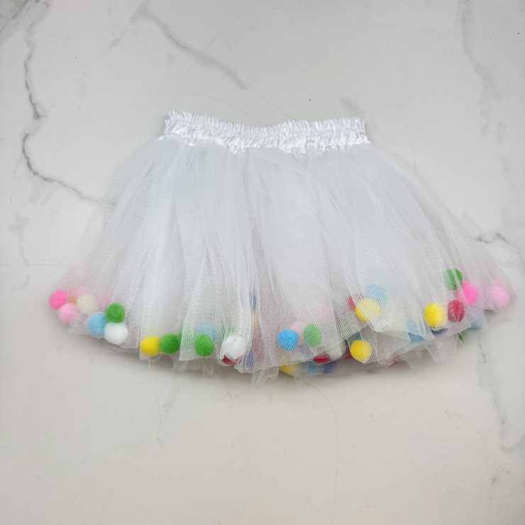 A photo of the Kids White Pom Pom Tutu - Multi product