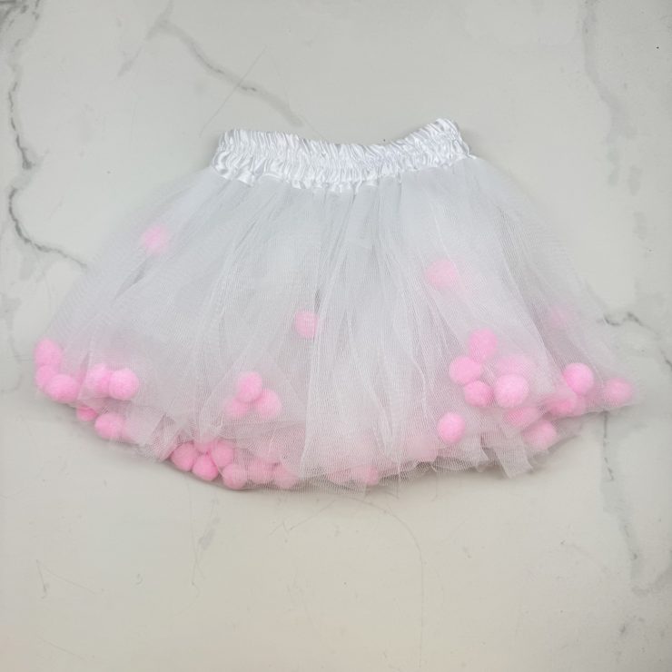 A photo of the Kids White Pom Pom Tutu - Pink product